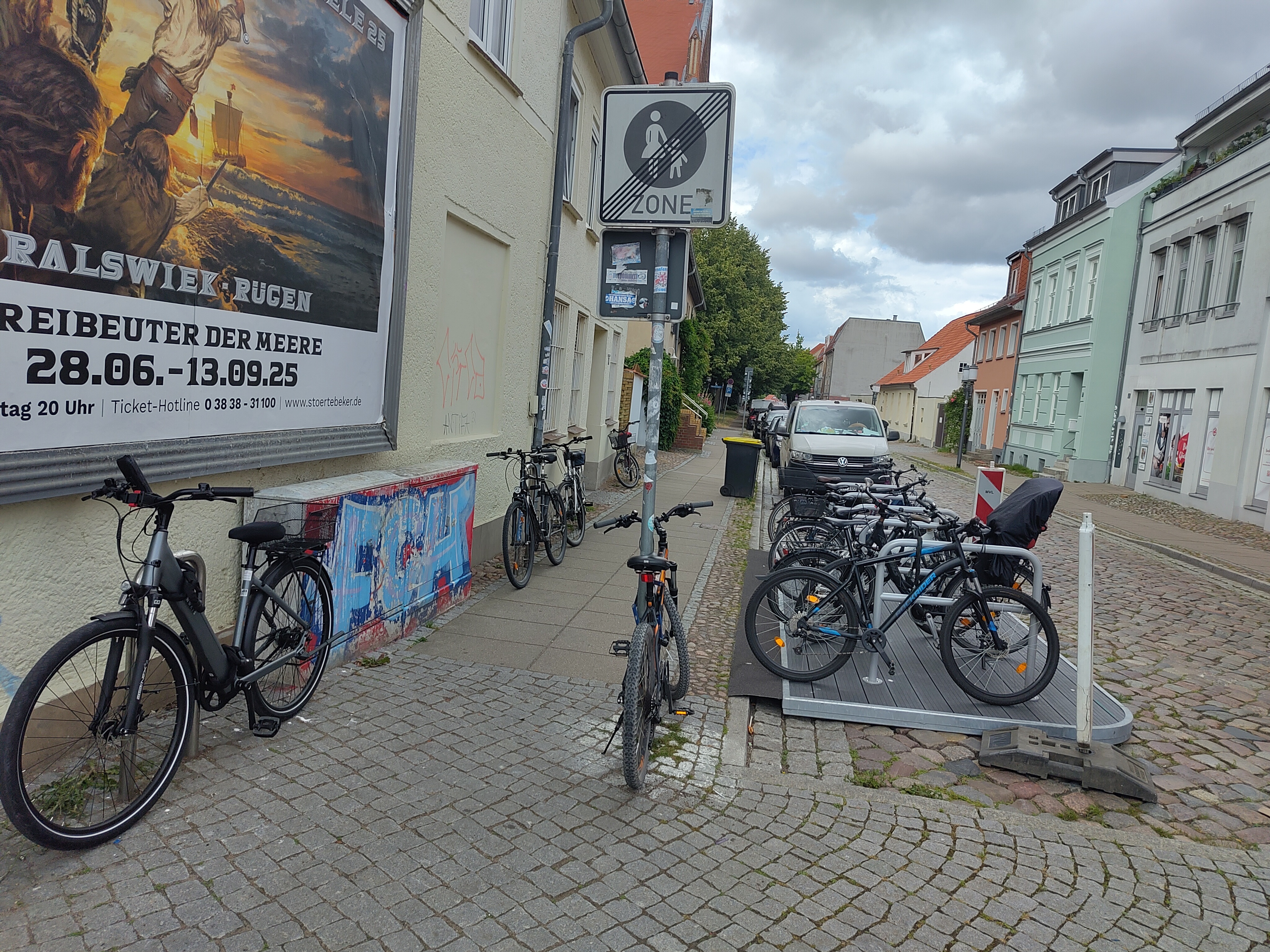 The photo of Greiswald showing the placement of the mobile bicycle parking unit on the foreground