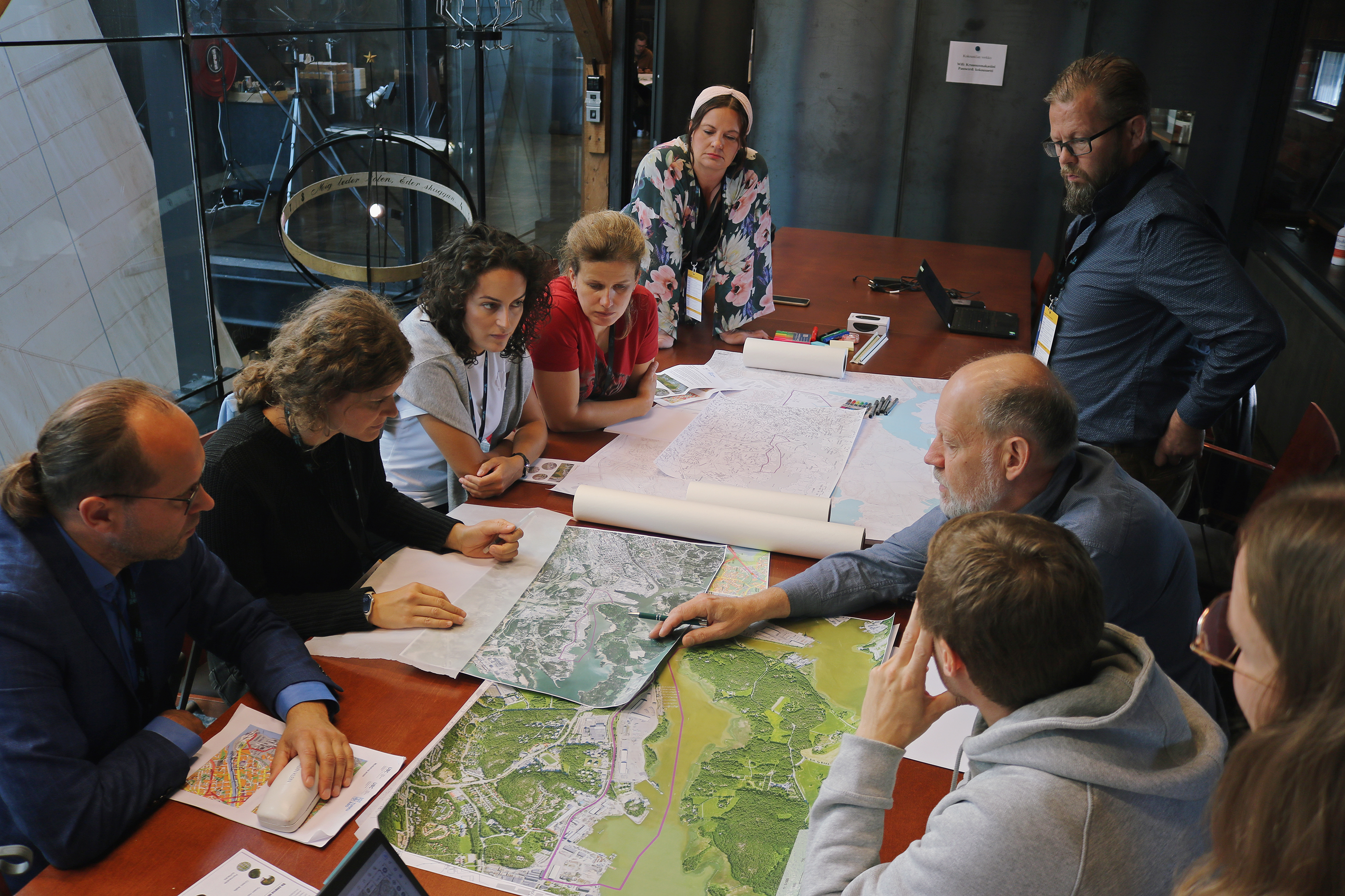 Group planning a city area in a roundtable setting.