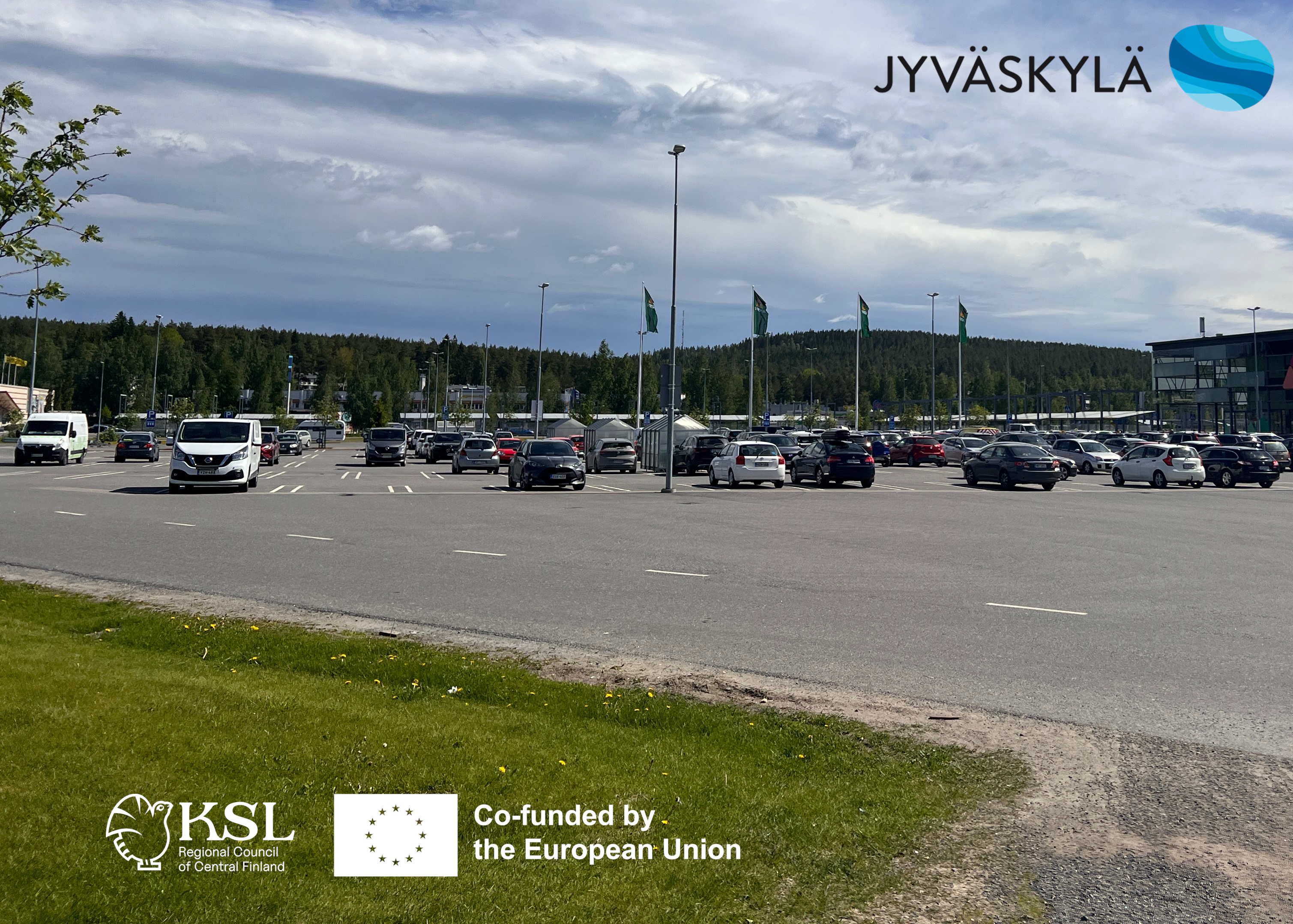 A sunny parking lot in Seppälä commercial district where applications of a green factor method are studied
