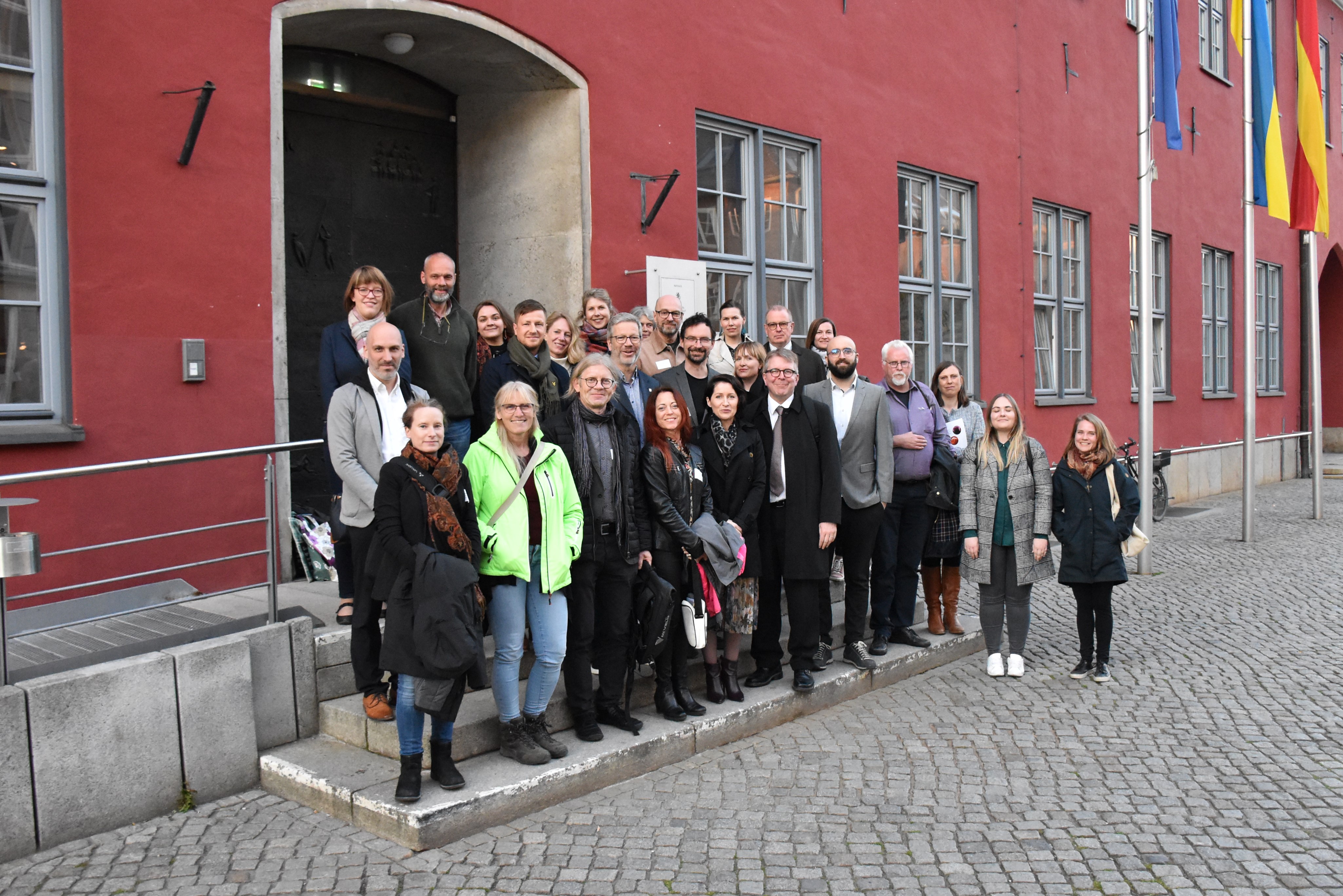 Group photo of the meeting participants on the steps of the City hall